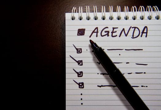 Notebook with agenda checklist for corporate retreat