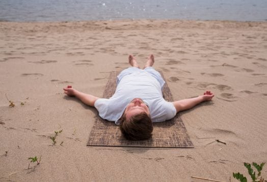 Man in Savasana Pose for yoga relaxation and joy