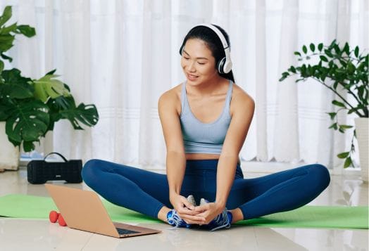Woman doing Butterfly Stretch yoga for flexibility exercise