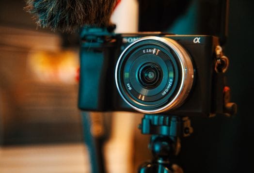 A Sony Alpha camera on a tripod