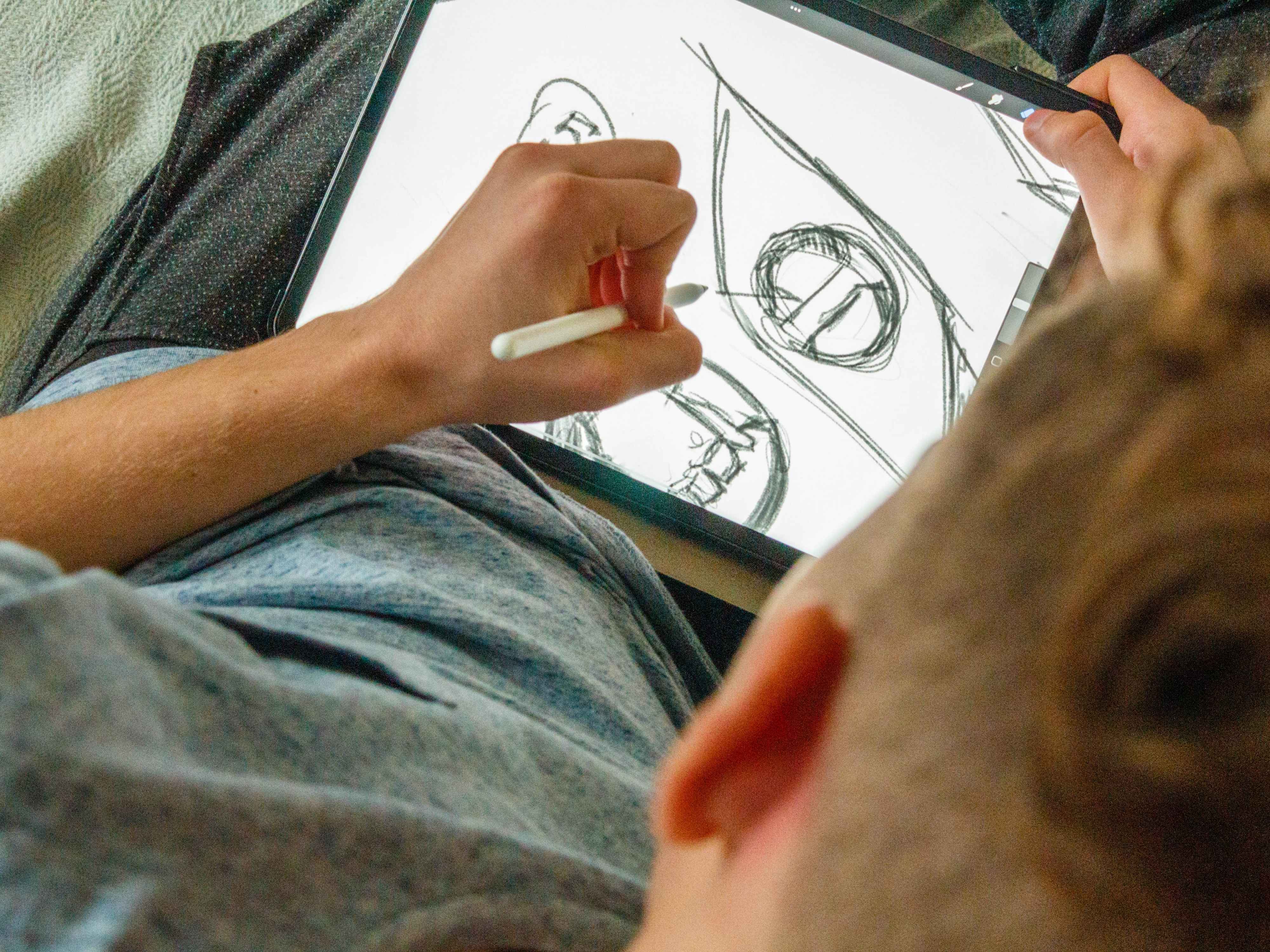 Digital artist sketching on a tablet
