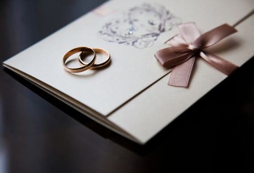 Wedding rings on invitation card