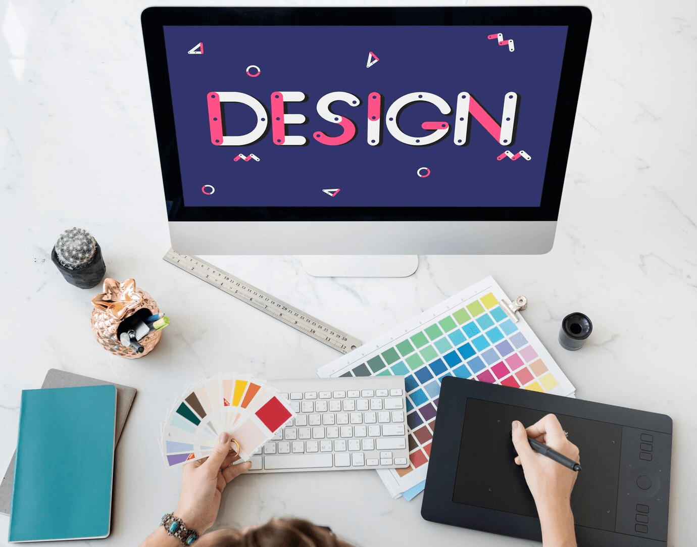 Graphic designer working at a desk