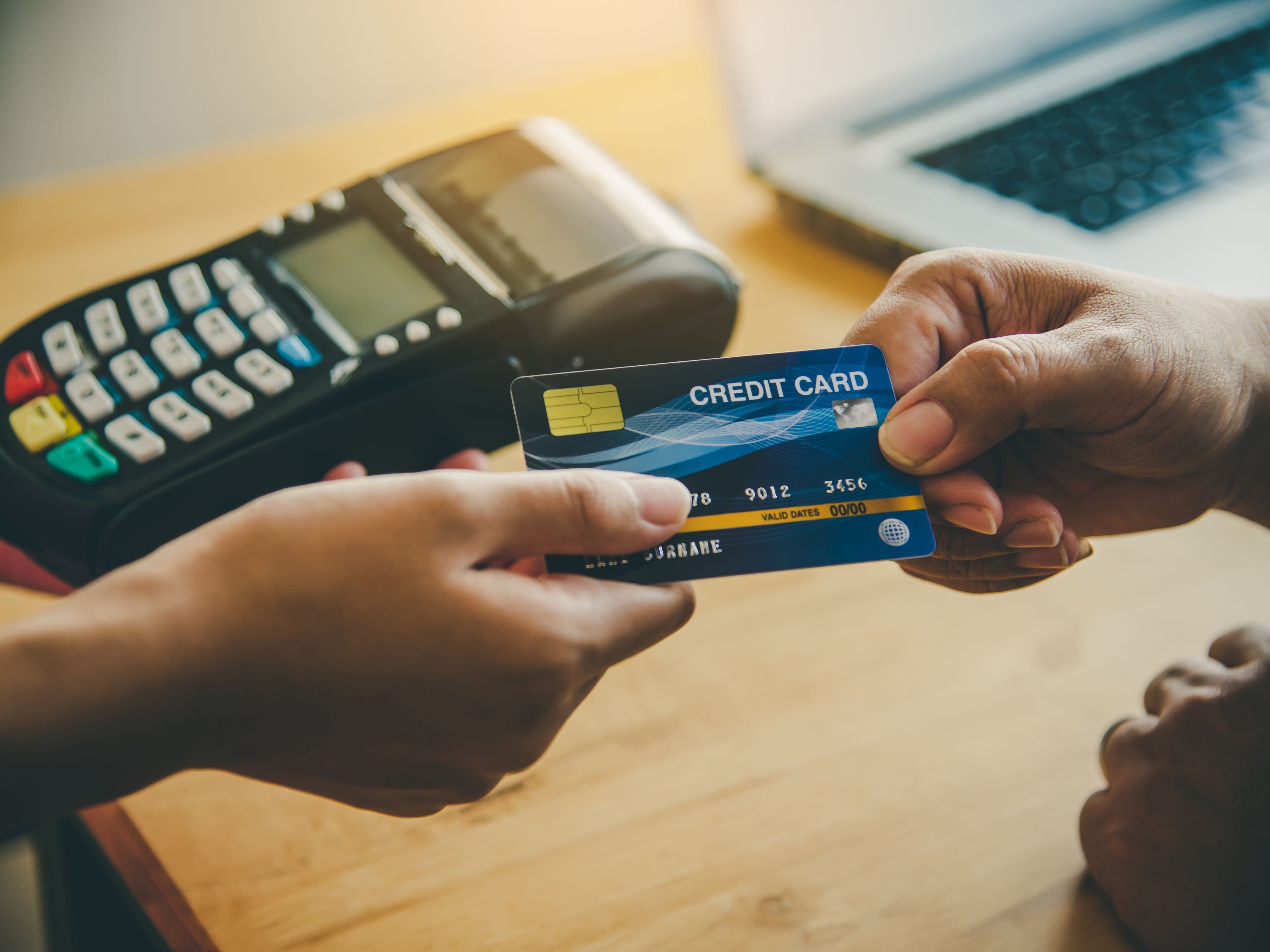 Handing over a credit card for payment