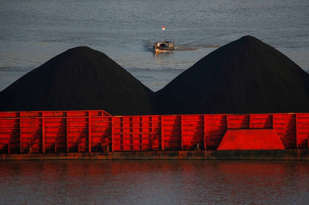 Britain tells climate talks coal era ending as carbon emissions surge