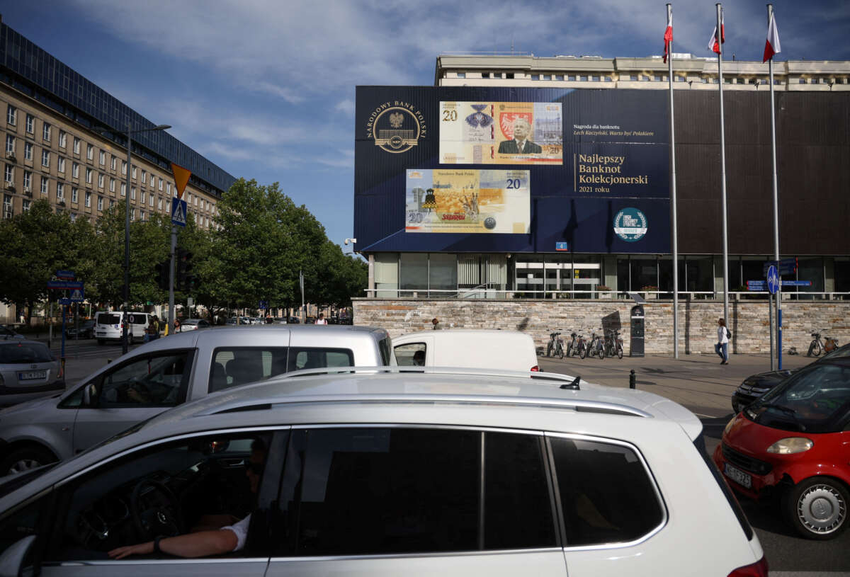 Polish central bank holds rates, points to slowdown ahead
