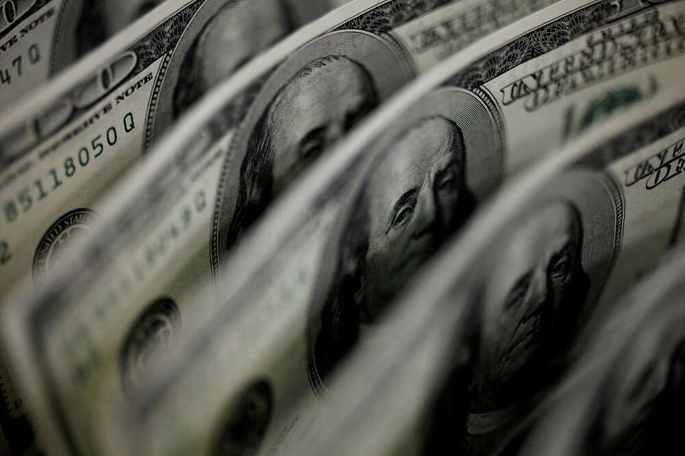 Dollar falls after Fed raises rates, forecasts future hike