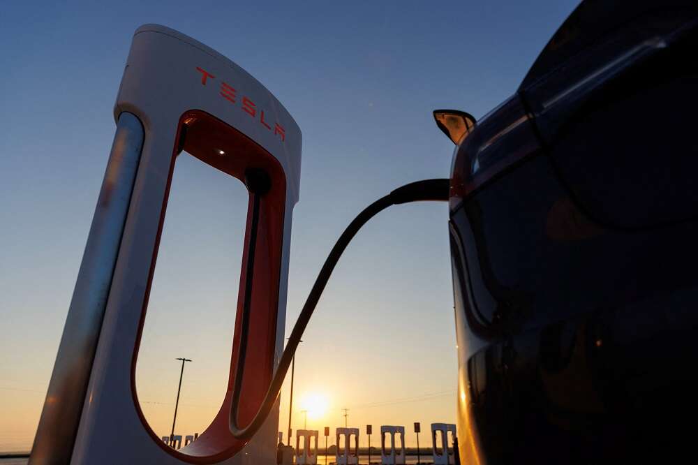 Factbox-More automakers plug into Tesla&#8217;s EV charging network
