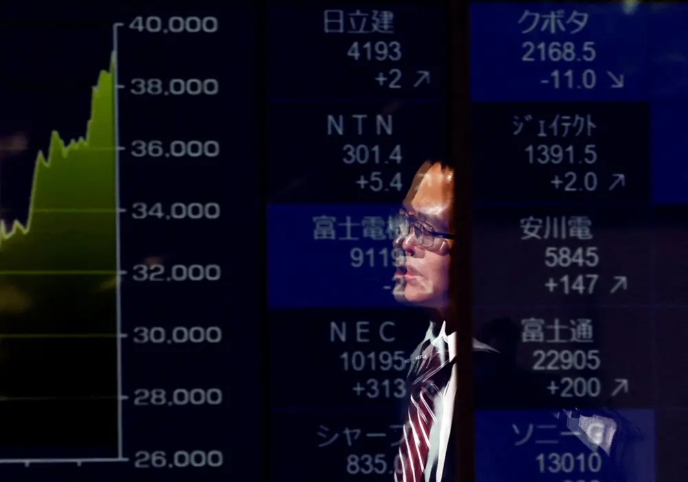 Stocks hold at record highs as traders bet on rate cuts