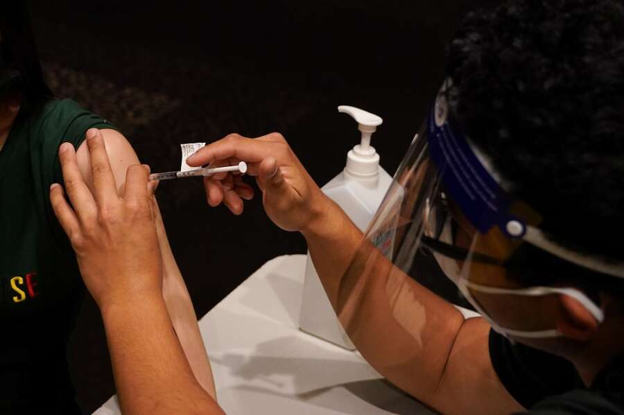 Factbox: Countries making COVID-19 vaccines mandatory