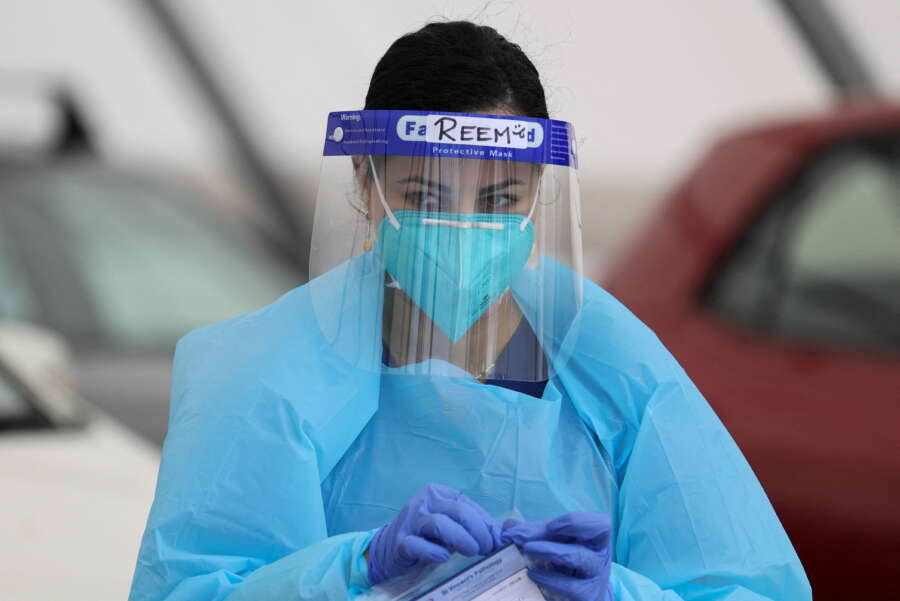 Australia COVID numbers hit a peak as Omicron outbreak strains domestic politics