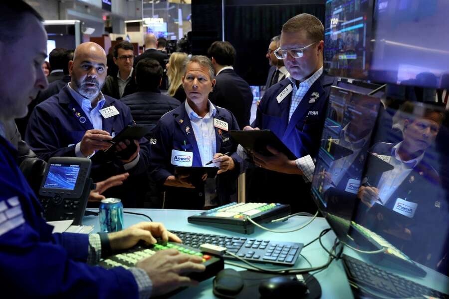 Stocks rise, U.S. yields slip as markets await Fed rate hike