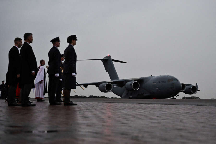 Plane carrying coffin of Queen Elizabeth lands in London