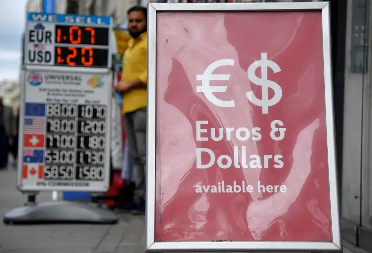 Sterling dips as investors look to UK jobs, inflation reports this week
