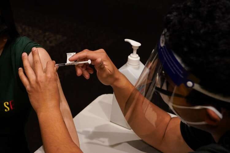 Factbox: Countries making COVID-19 vaccines mandatory