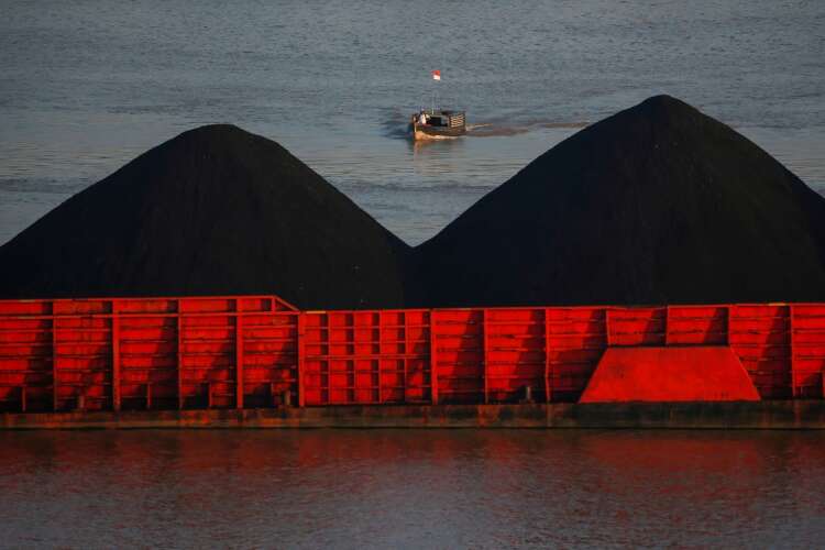 Britain tells climate talks coal era ending as carbon emissions surge