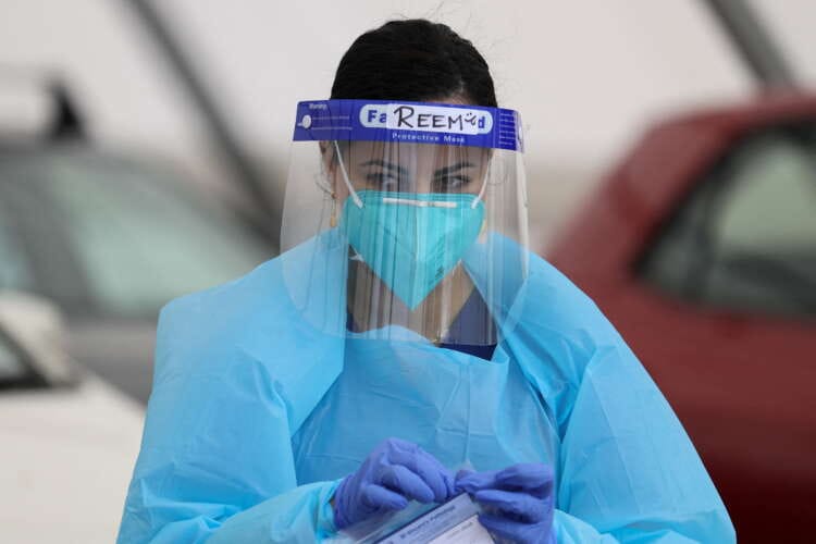 Australia COVID numbers hit a peak as Omicron outbreak strains domestic politics