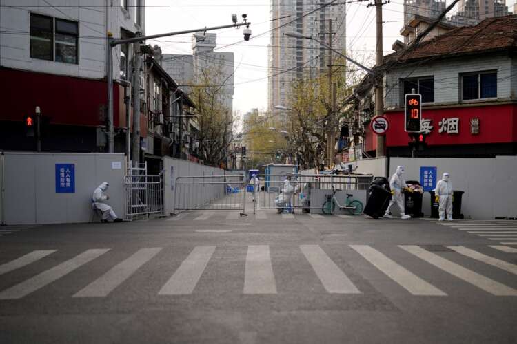 Shanghai expands COVID lockdown as new daily cases surge by a third
