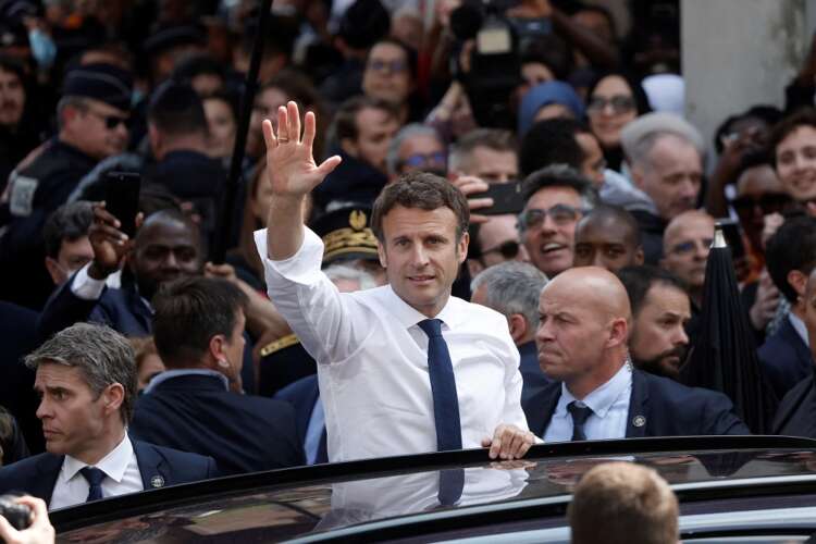 Macron, with eye on parliamentary vote, visits left-leaning Paris suburb