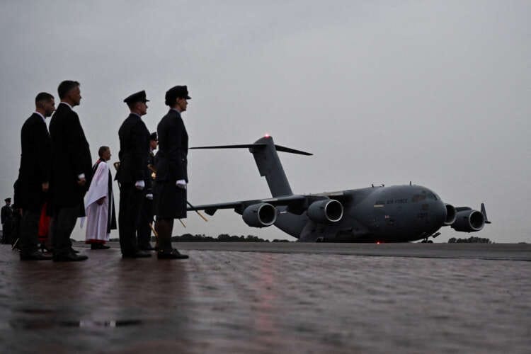 Plane carrying coffin of Queen Elizabeth lands in London
