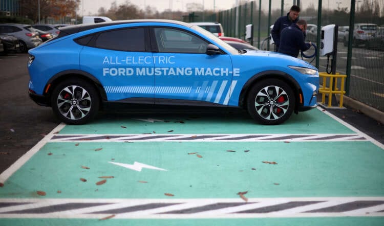Ford posts lower profit, issues downbeat outlook; shares drop
