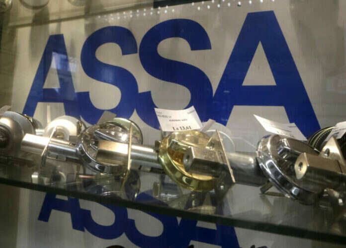 Lockmaker Assa Abloy boosts dividend, but wary on outlook