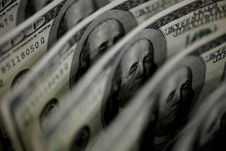 Dollar falls after Fed raises rates, forecasts future hike