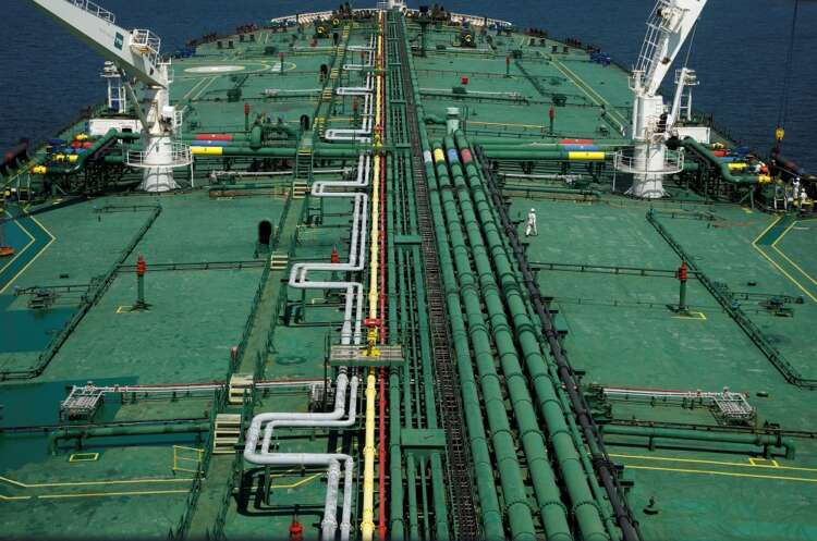 Oil up 2% as dollar weakens on small US Fed rate hike