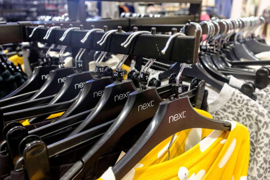Britain&#8217;s Next sticks to outlook after quarterly sales rise