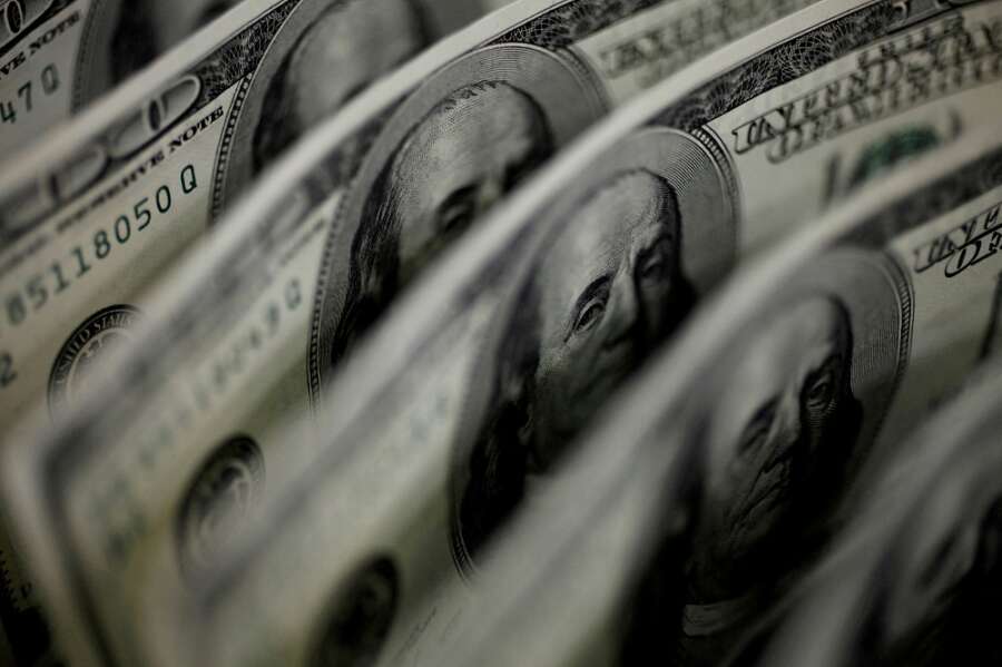 Dollar falls after Fed raises rates, forecasts future hike