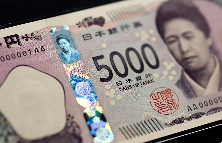 Dollar sinks vs yen, hovers near 2-1/2-year low to sterling on dovish Fed shift
