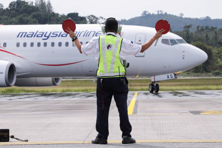 Asia&#8217;s airlines ramp up flights, offers as tough COVID travel curbs ease