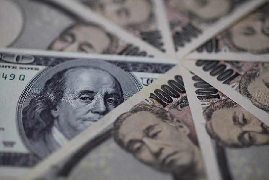 Dollar jumps, euro dips before Fed minutes